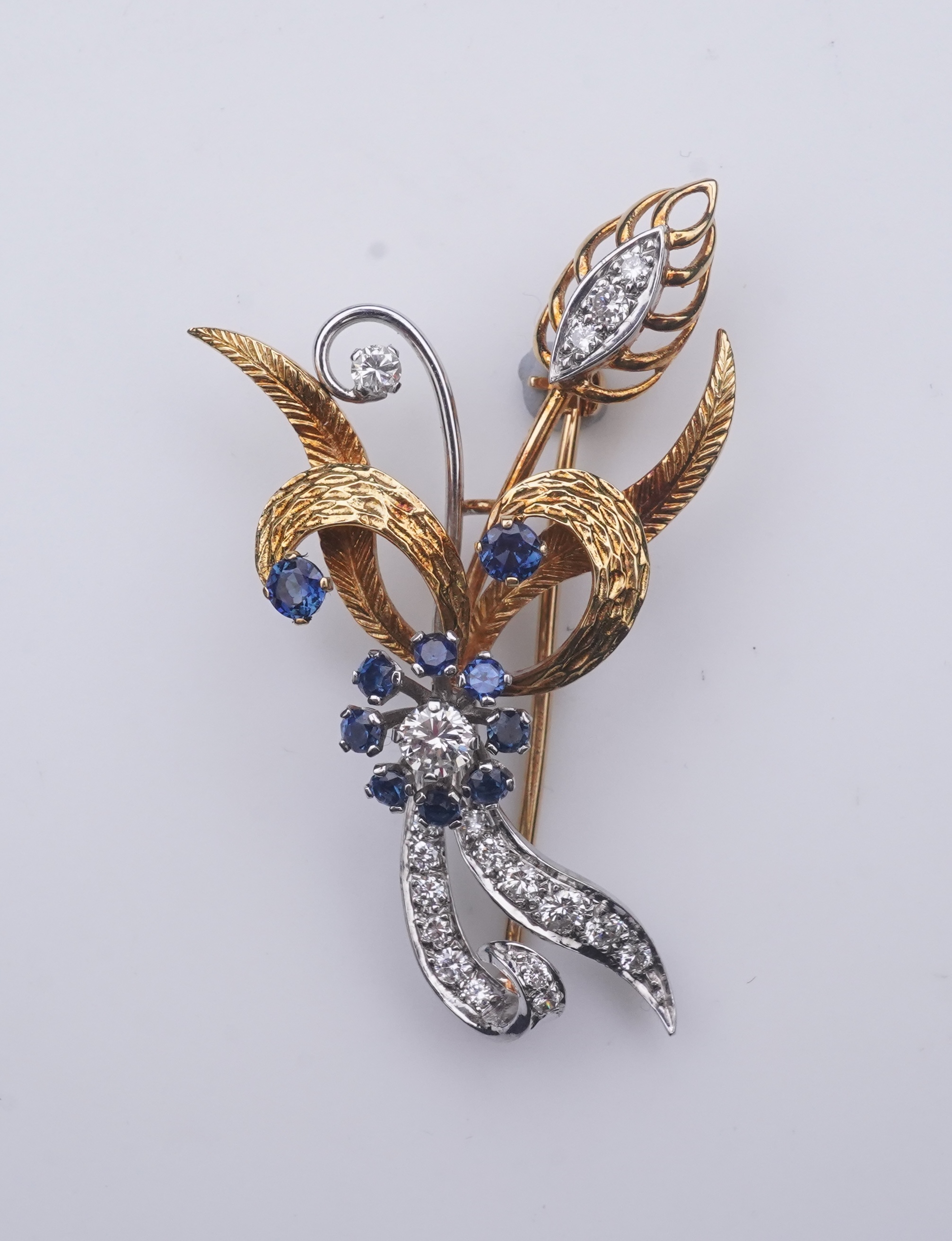 A sapphire and diamond brooch, third quarter 20th century